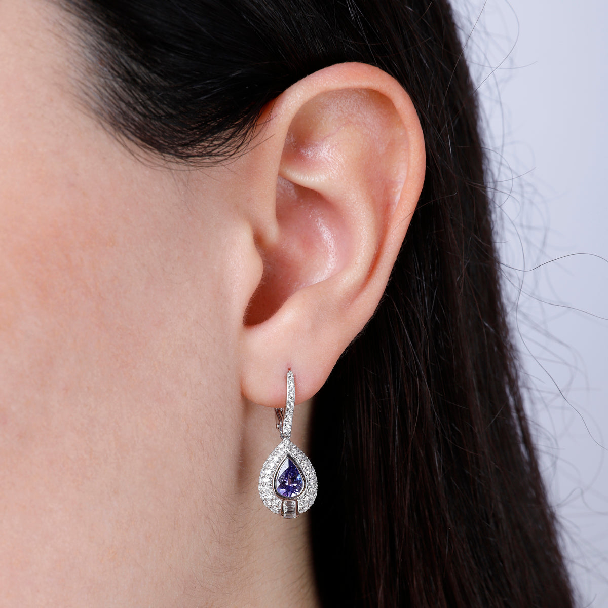 Precious stone teardrop cut earrings surrounded by a diamond halo. Effortless beauty for everyday
