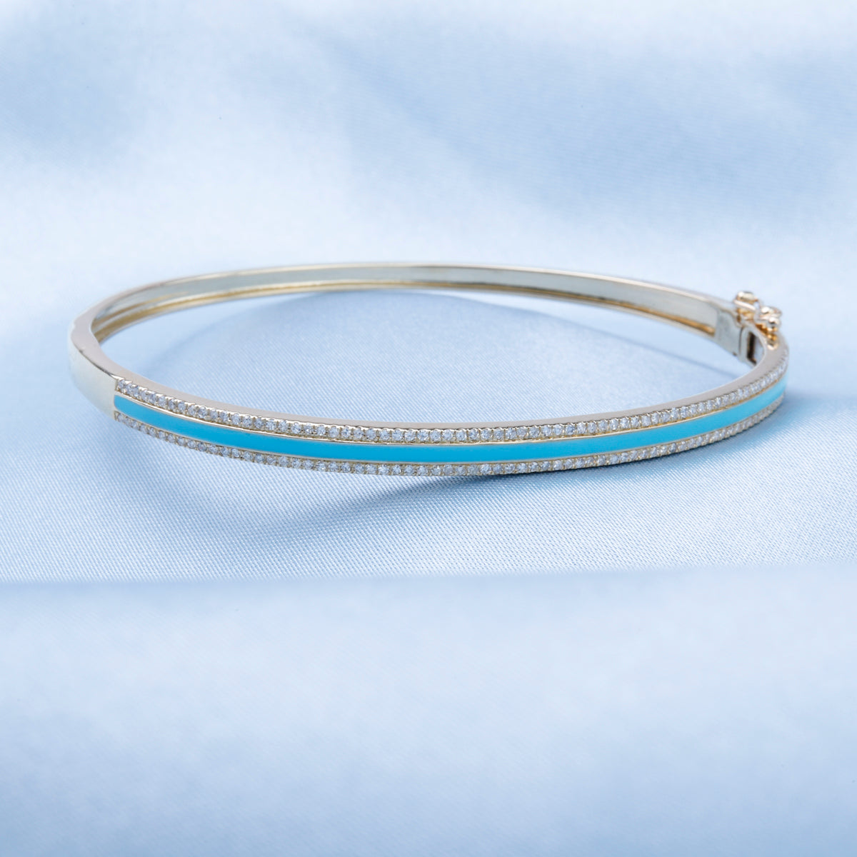 Enamel bangle with a row of diamonds. A pop of color to enhance the vibrant enamel color.