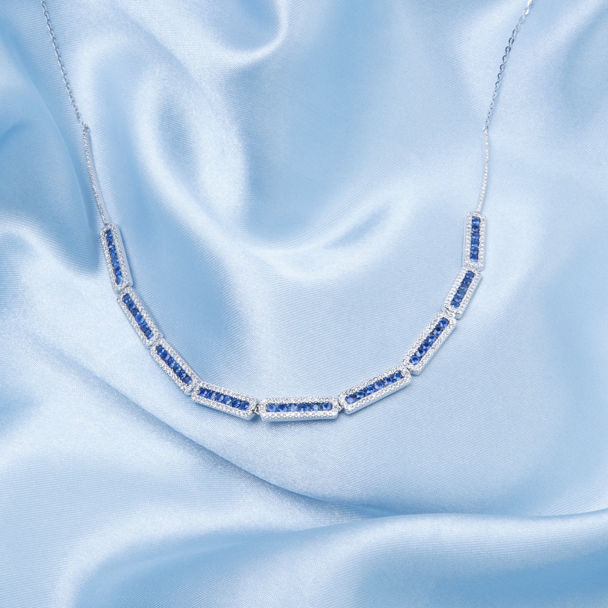 Delicate halo design and secure closure, with a variety of precious options. 