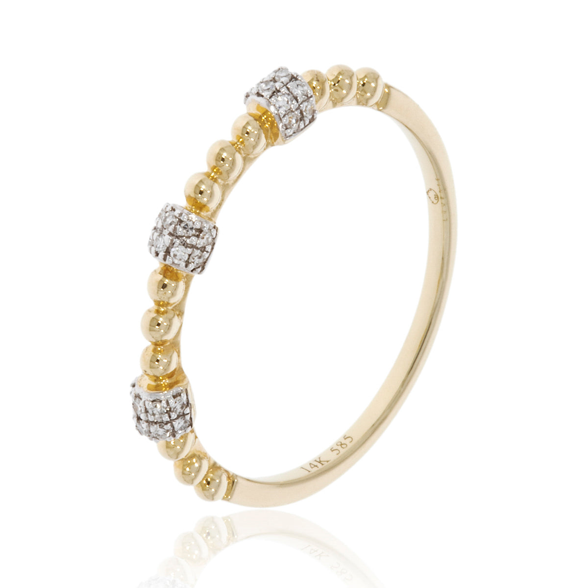 Beaded diamond stacking band features a row of sparkling diamonds perfectly placed around the ring.