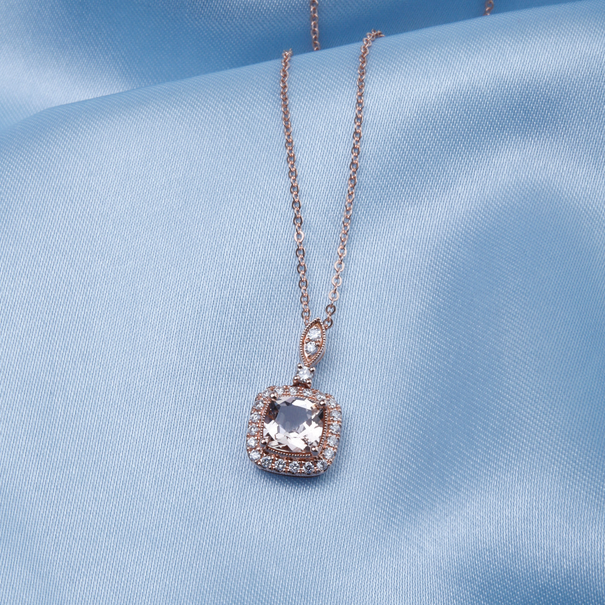 Cushion Cut Necklace displaying an intricate arrangement of diamonds and a center precious stone