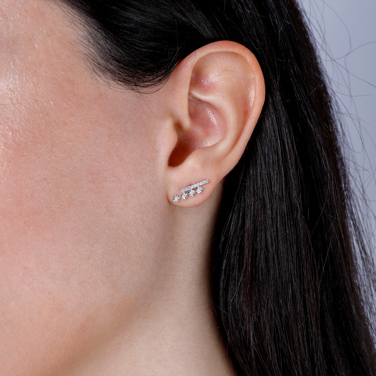 A captivating design with a row of round diamonds colliding with a sleek bar of diamonds