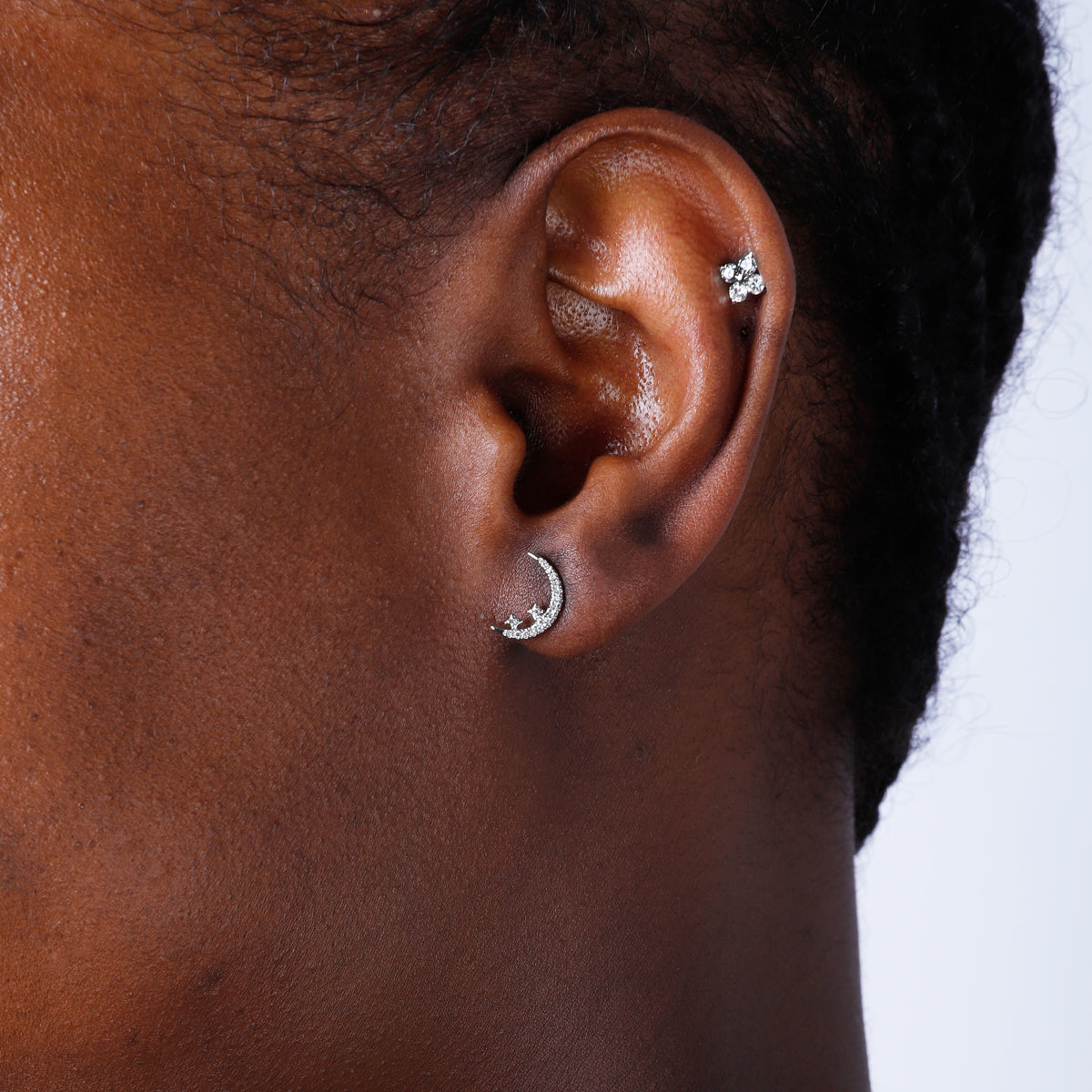 Diamond moon studs with shiny diamonds to elevate the added star design. 