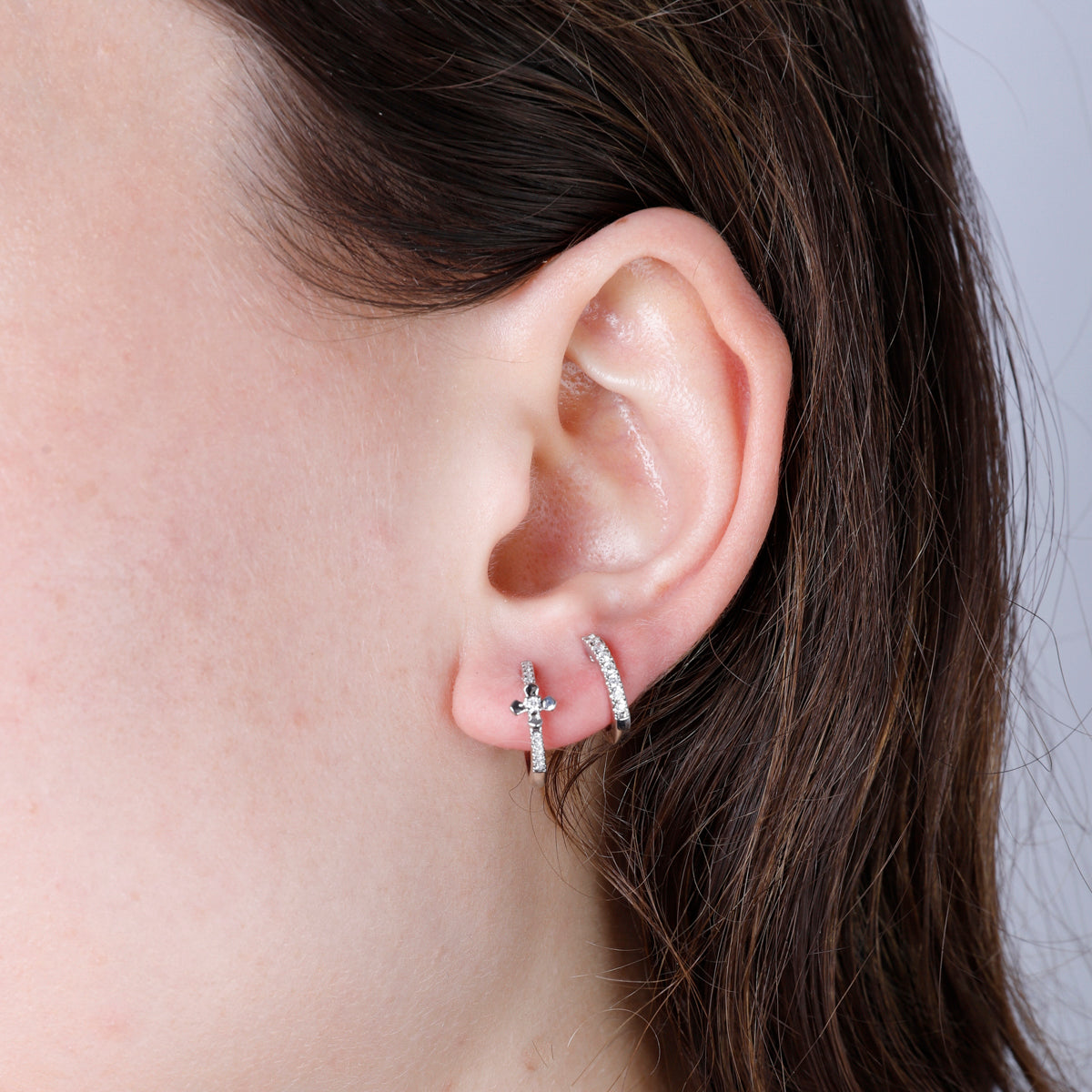 Classic hoops with cross pave design. The intricate design makes for an eye-catching touch