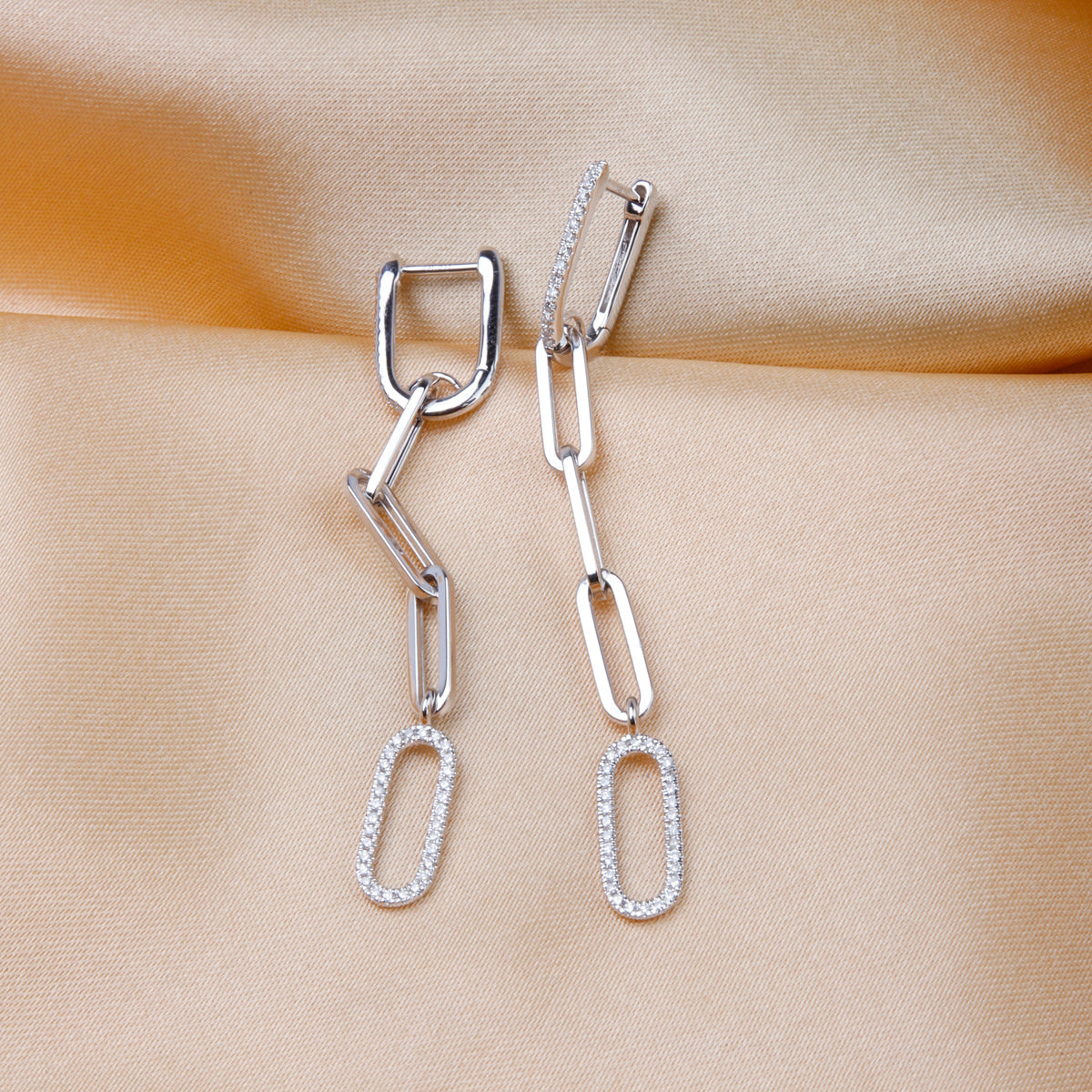 Paperclip Chain style earrings that dangle. Diamonds on some of the links to make them stand out. 