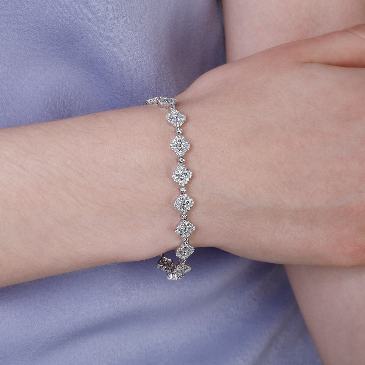 Timeless clover inspired bracelet with precious stones and a diamond halo. Crafted with attention. 