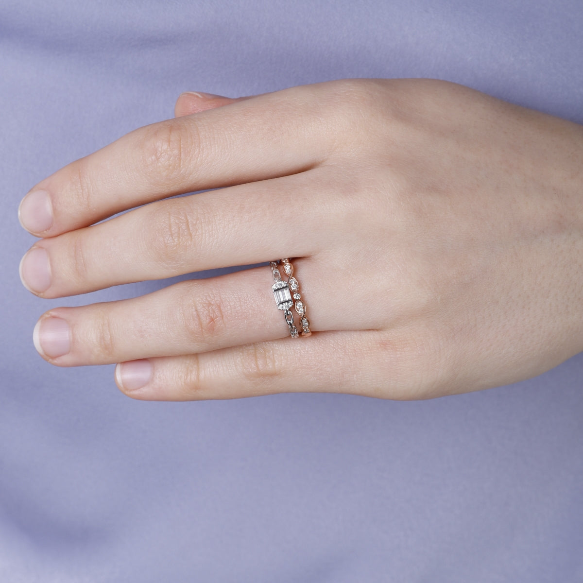 A dainty statement piece with a center baguette cut diamond with a chain link design. 