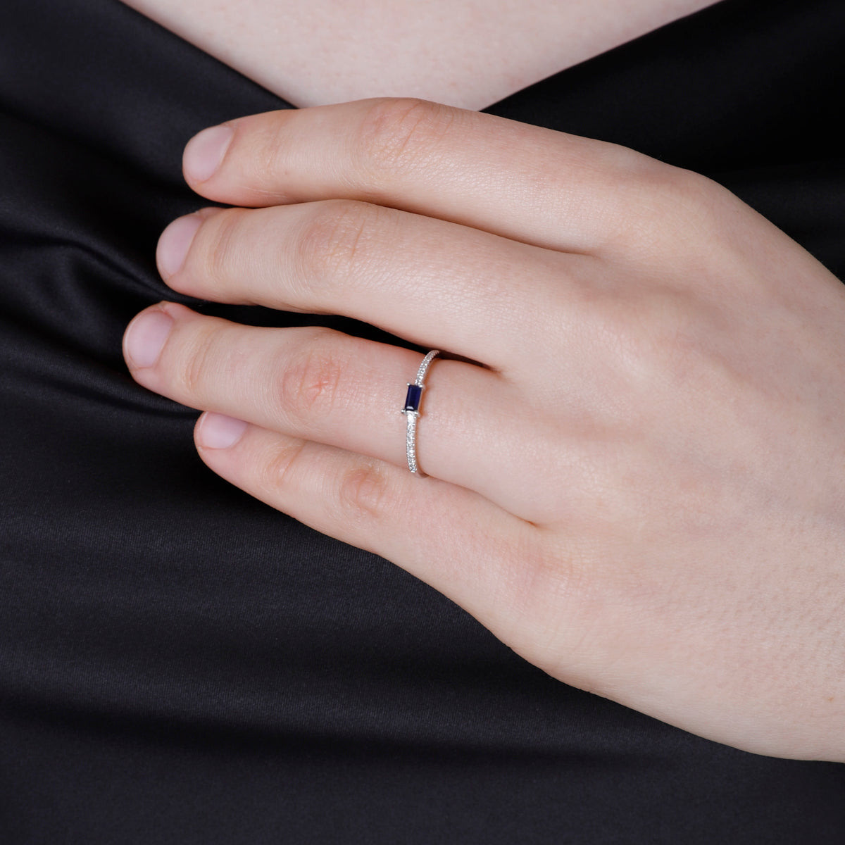 Baguette Stacking Ring has a diamond cluster on an eternity band. A variety of precious stones. 