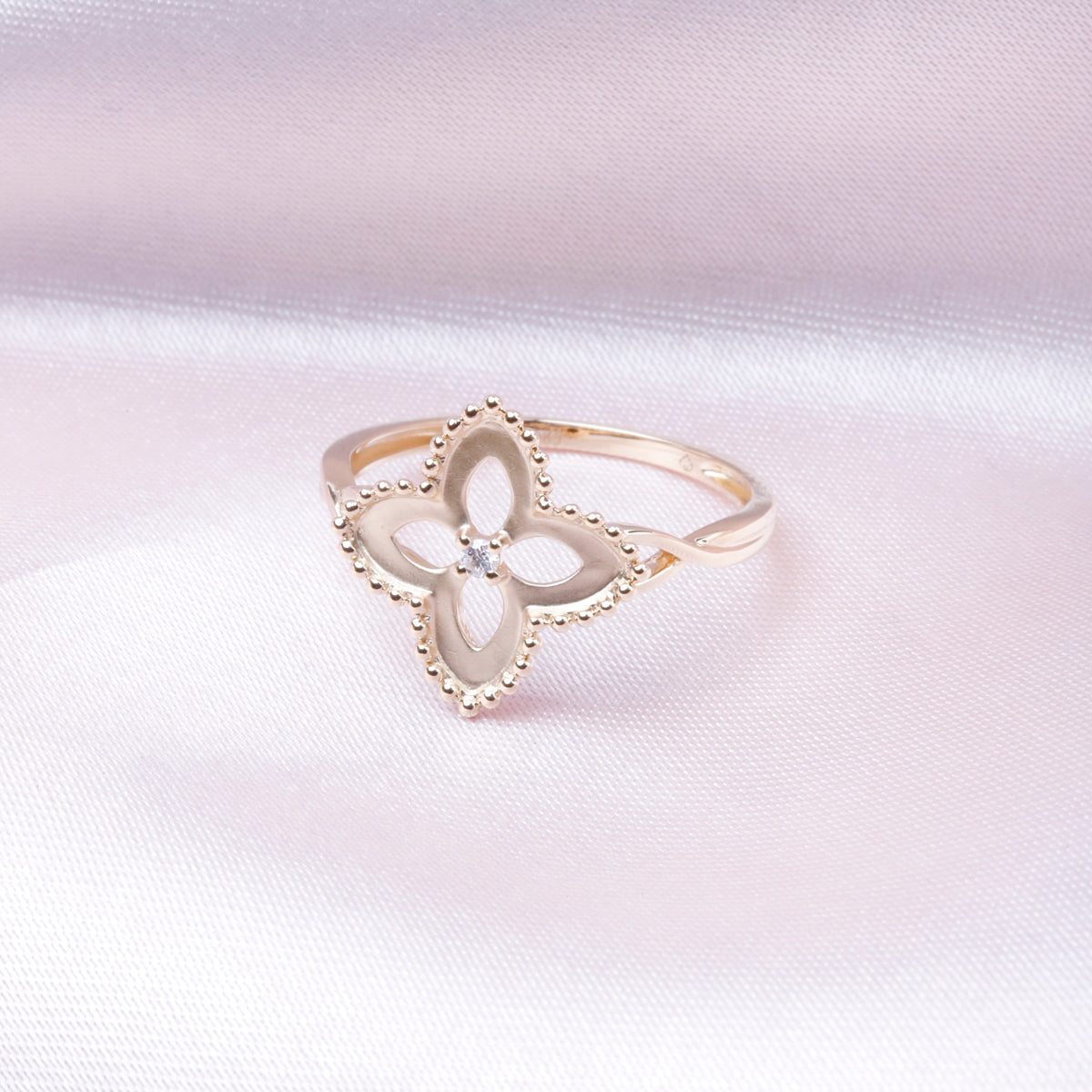 Beaded floral diamond ring entwined floral detailing and beaded details.