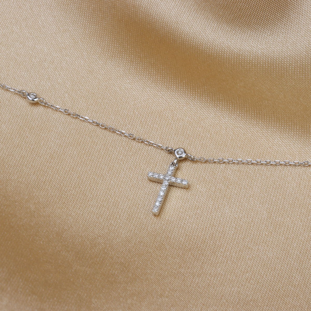 Classic pairing of a gold cross and rosary beads perfect for everyday. 