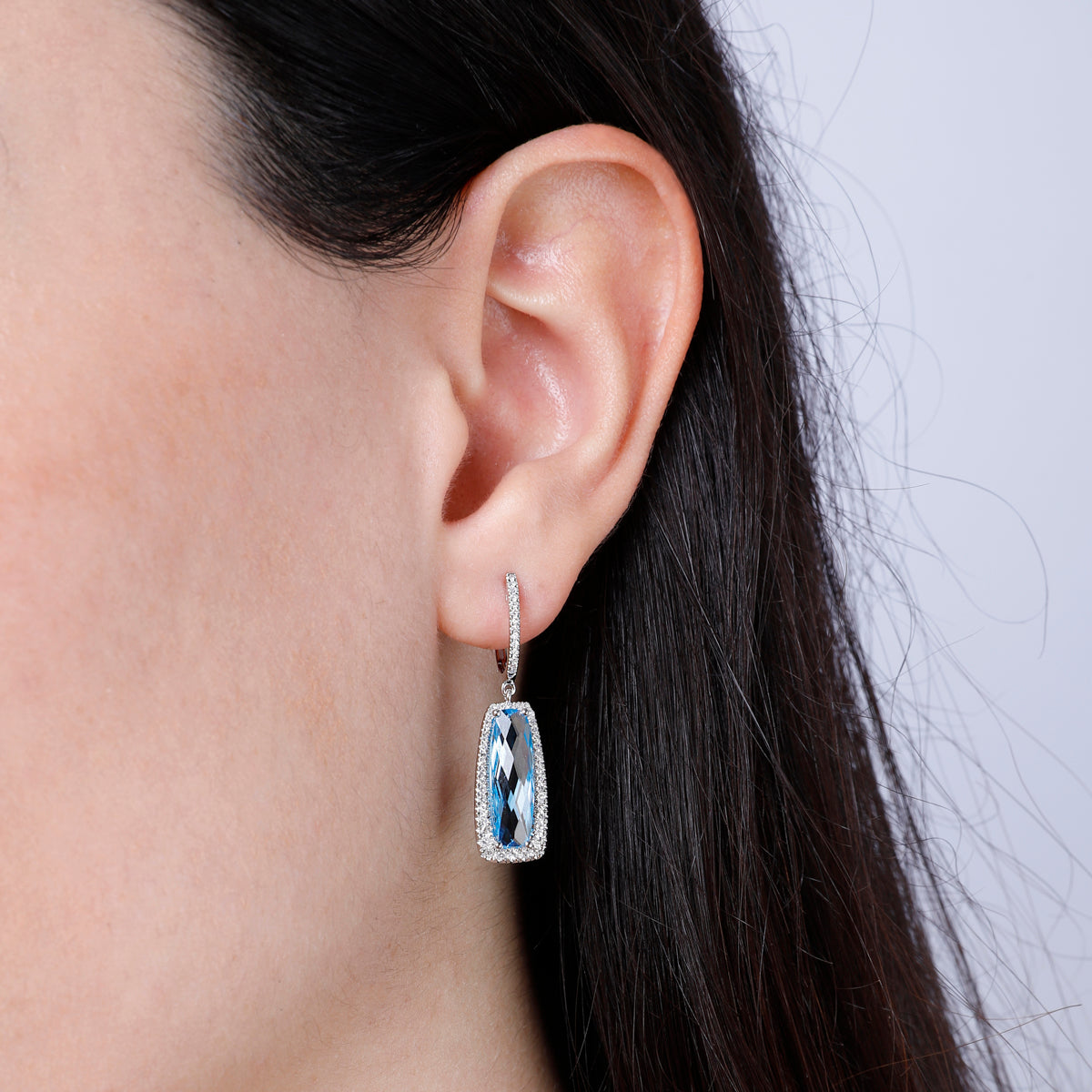 Dangle Gemstone Earrings with a halo of diamonds illuminating the playful gem for any special event