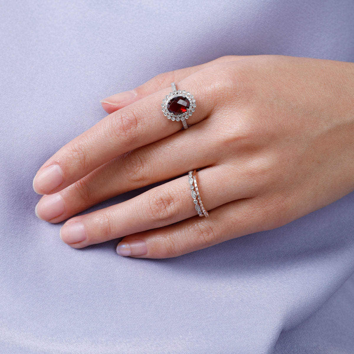 Intricately carved floral patterns and gemstones in the center adds to the ring's luxurious aura. 