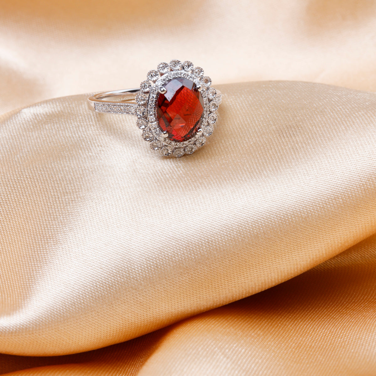 Intricately carved floral patterns and gemstones in the center adds to the ring's luxurious aura. 