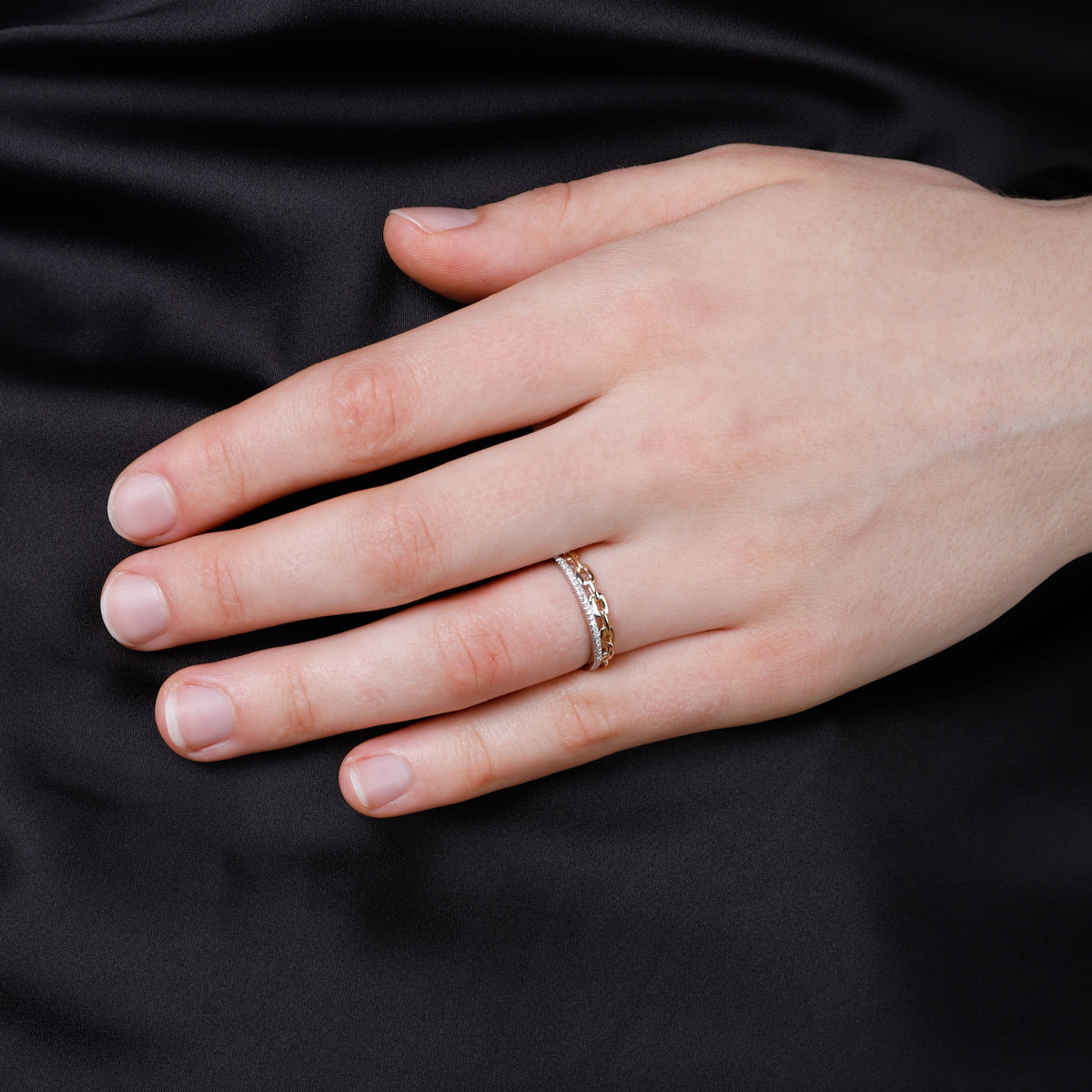 Featuring a diamond at the center, accented by dazzling bar settings and linked to an elegant chain.
