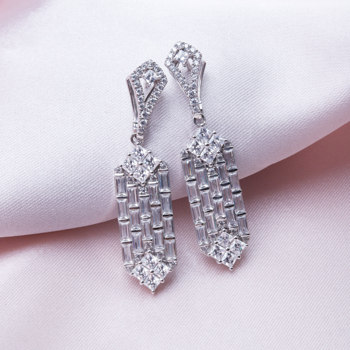 Baguette Earrings with delicate silhouette and baguette cut diamonds make a statement.