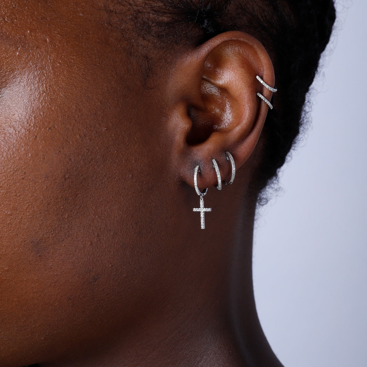 Dangle Cross Earrings for everyday use. Secure closure and shimmering diamonds. 