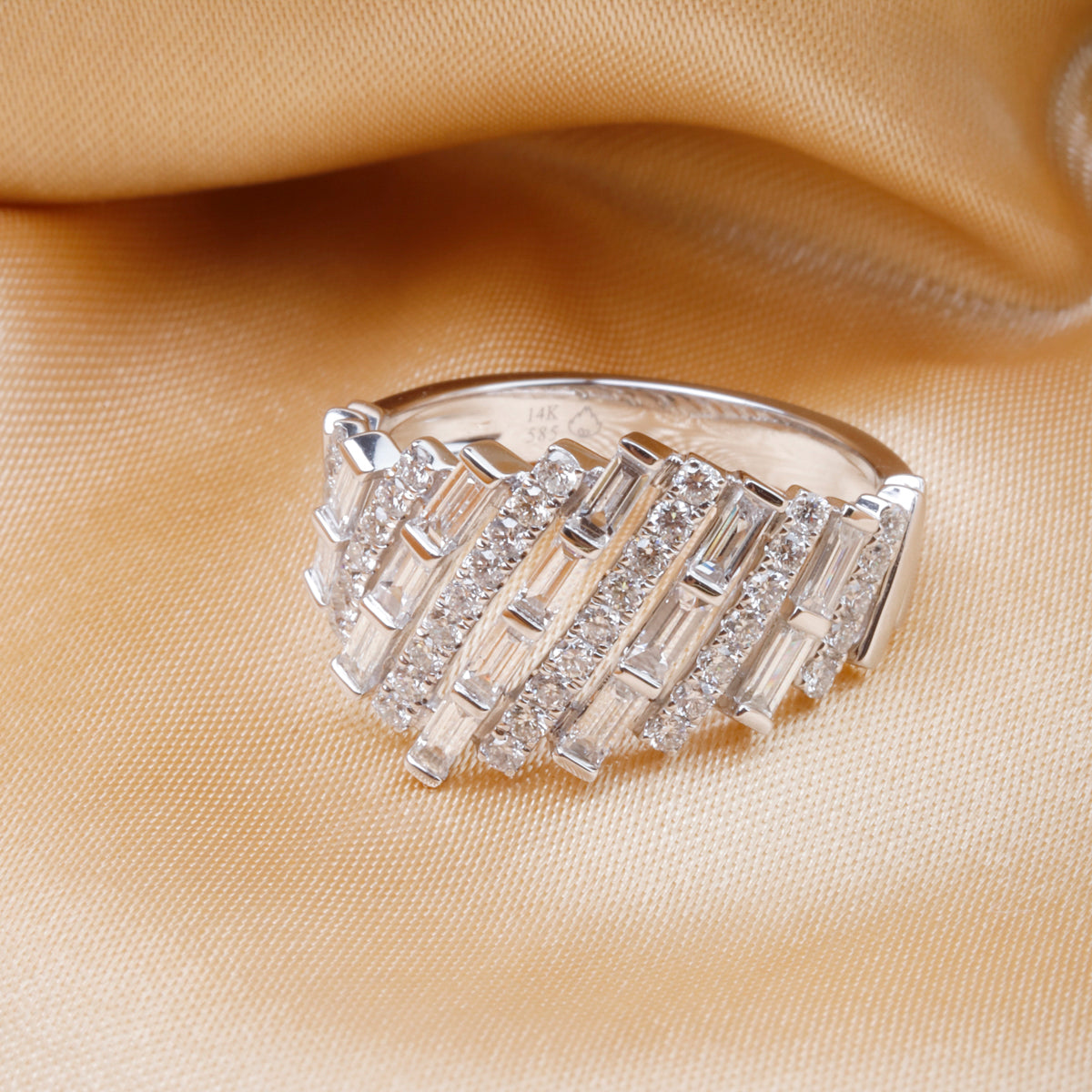 14k baguette statement ring, embellished with dazzling diamonds encircling the elegant baguettes.