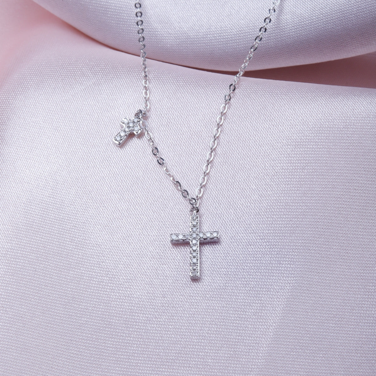 Intricately designed cross and charm add a touch of finesse and elegance. Perfect for everyday