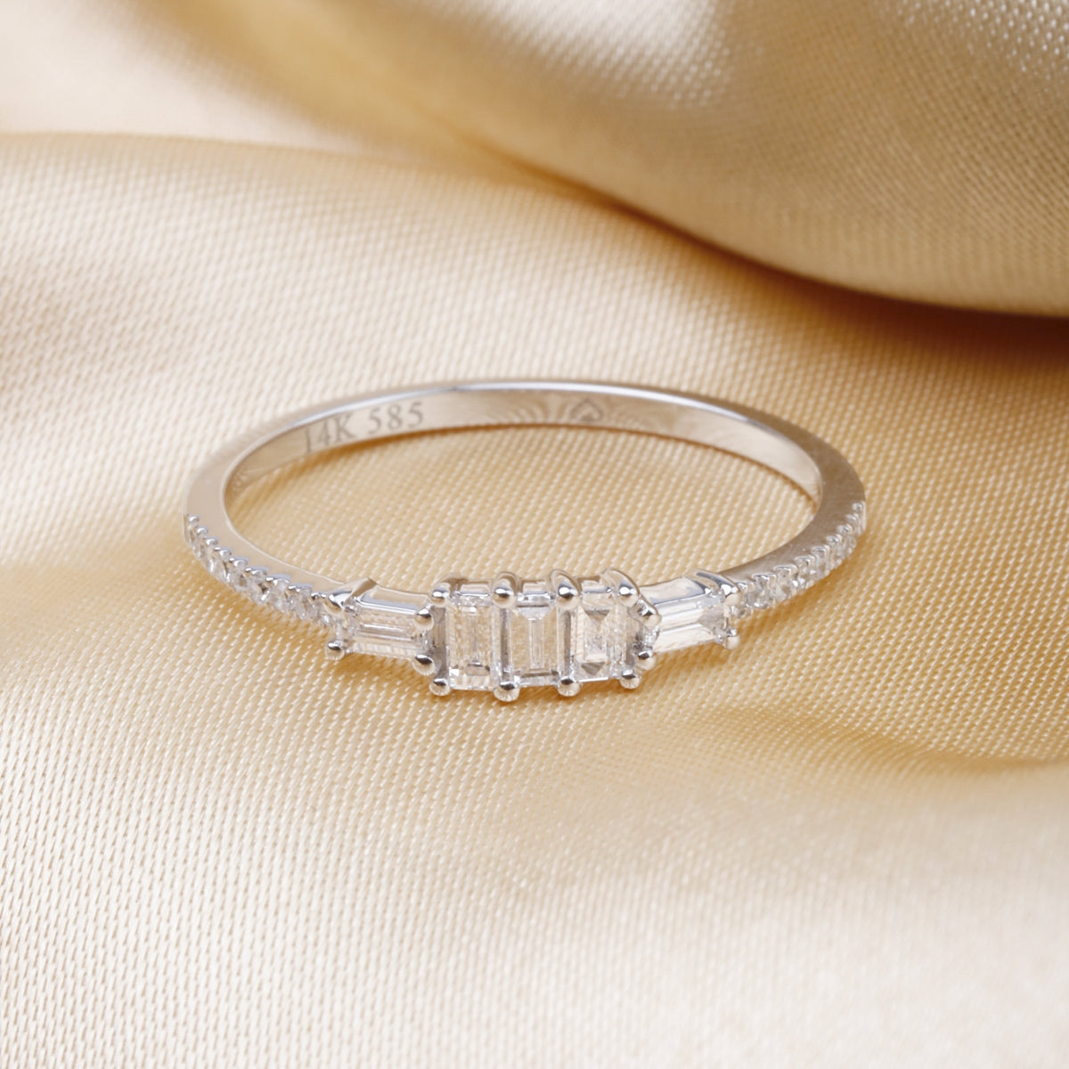 14K Diamond Ring, mesmerizing baguette cut diamonds are set on the sleek stackable band. 